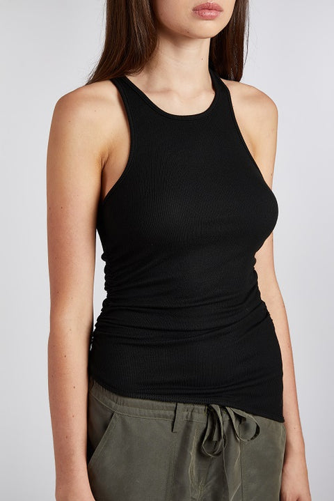 Close up view of a versatile and elegant black racerback tank top with an asymmetric hem. Made from soft, stretchy, and sustainable fabric for a comfortable and long lasting fit.